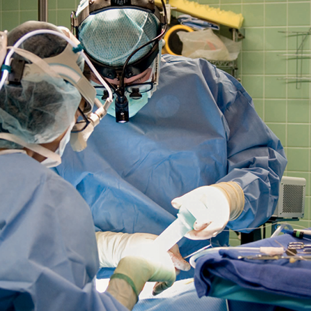 Two doctors performing surgery